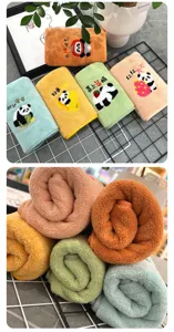 Soft coral fleece face towels with cute panda embroidery, colorful absorbent daily towels detail.