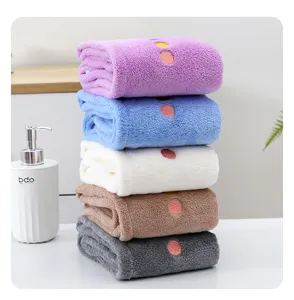 Thickened coral fleece quick-drying towel detail view, ultra-absorbent soft bath towel stacking.