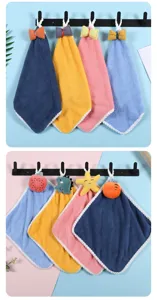 Thickened coral fleece hanging hand towel with cute cartoon plush decor for kitchen and bath.