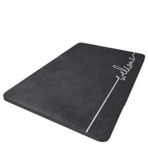 Minimalist dark grey diatomaceous earth bath mat with welcome text, anti-slip floor rug.