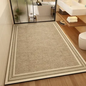 Detailed view of large absorbent bathroom floor mat with elegant border pattern in modern home.