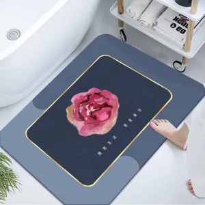 Alfombra de baño absorbente de tierra de diatomeas con diseño floral rosa y borde.