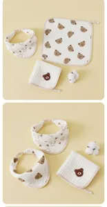 Detailed view of 6-layer gauze baby bibs and square towels with cute bear embroidery.