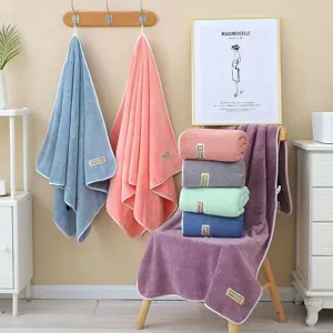 Soft coral fleece bath towel set, absorbent and comfortable home shower towel in solid colors.