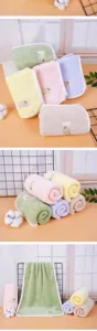 Soft coral fleece face towel with label, highly absorbent solid color daily towel.