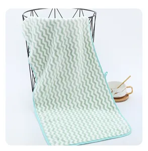 Soft coral fleece wavy pattern towel detail view, absorbent facial towel for home and kitchen use.
