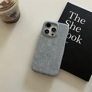 Detailed view of grey denim texture phone case for iPhone, stylish minimalist design style.