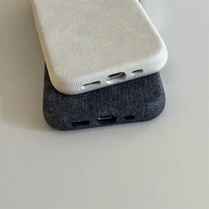 Detail view showing the bottom cutouts of fabric texture phone cases in two colors.