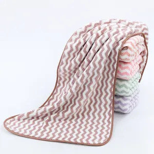 Soft coral fleece towel with wavy chevron pattern and neat brown edge binding. Perfect daily use.