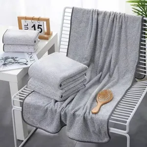 Grey coral fleece bath towel and face towel set, thick and soft home bathroom towel products.