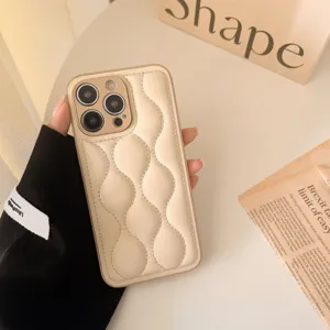 Puffy down jacket style phone case detail, soft leather texture, wave quilted design.