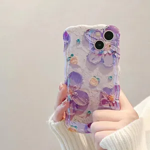 Silicone protective phone case featuring an artistic oil painting purple floral design with wavy edges.