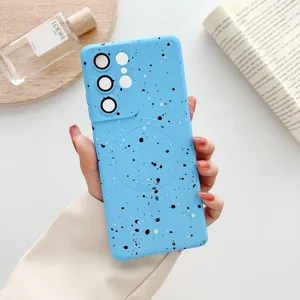 Detailed view of blue splatter magnetic phone case, TPU soft cover with camera protection.