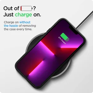 Close-up detail of wireless fast charging pad and protective phone case in daily use.