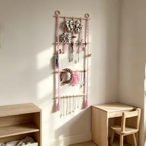 Wall hanging headband and hair bow organizer for girls room decor with wooden rods and pink tassel