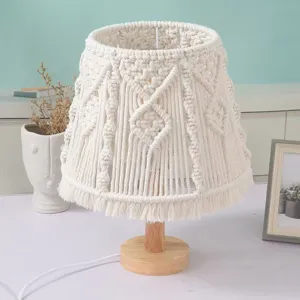 Handmade macrame lampshade detail view, boho woven cotton cord decorative light texture.