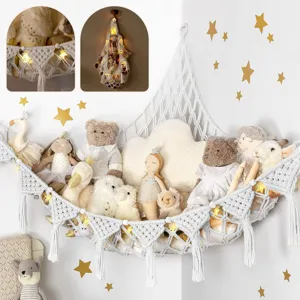 Bohemian handmade macrame toy hammock detail, corner hanging plush storage net with tassels.