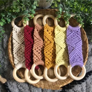 Handmade macrame wooden ring hanging organizer set, Nordic style home decor accessory detail.