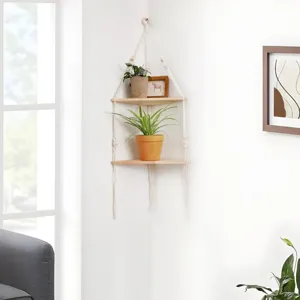 Detail view of the Bohemian corner wall shelf with potted plants in a cozy living room.