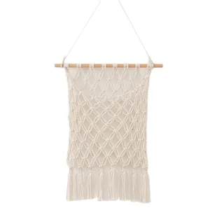 Handmade macrame wall hanging storage bag boho cotton rope organizer for home room decor.