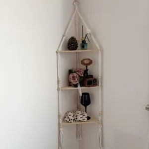 Boho macrame corner wall shelf, rustic wooden floating shelves for stylish living room home decor.