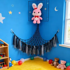 Corner toy storage hammock for kids room, black mesh net with hanging tassels display.