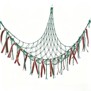 Green macrame toy hammock with decorative ribbons, wall hanging kids room storage net.