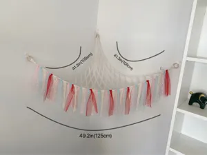 Handmade macrame toy hammock with colorful ribbons, corner plush toy storage net organizer.