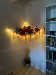 Handmade cotton rope toy hammock corner net with colorful ribbons and fairy lights for kids room storage