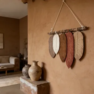Handmade bohemian woven cotton rope feather wall hanging detail, rustic boho home decor tapestry