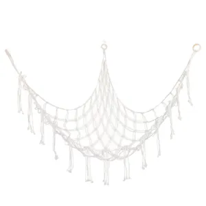 Handmade cotton rope toy hammock corner storage net with tassels for kids room organization.