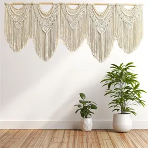 Macrame wall hanging detail view featuring bohemian style, natural cotton cord with wood rod.