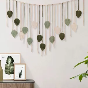 Handmade macrame leaf wall hanging, woven cotton tapestry with wooden beads for home decor.