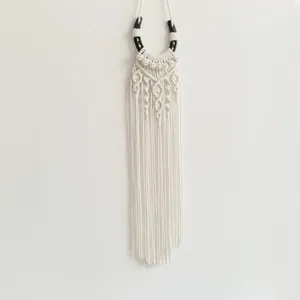 Handmade macrame wall hanging with horseshoe element bohemian western home decor tapestry.