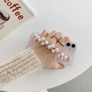 Pearl chain phone case detail view showing shiny acrylic shell texture and elegant design features.