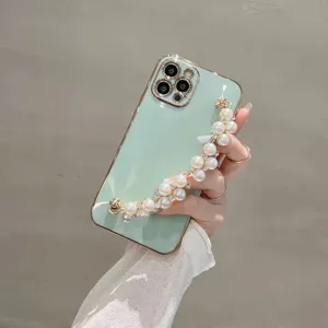 Mint green electroplated phone case with elegant pearl bracelet strap for daily use and stylish look