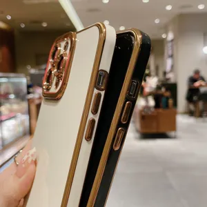 Electroplated phone case for iPhone with luxury metal button and camera protection cover.