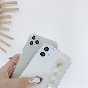 Clear phone case detail featuring elegant pearl bracelet chain and soft edge protection.