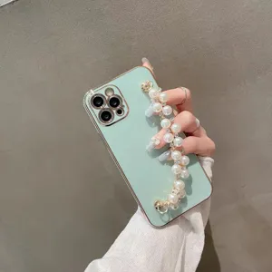 Detailed showcase of mint green phone case featuring elegant pearl chain strap accessories.