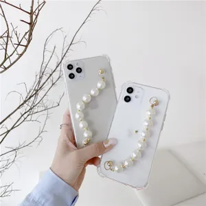 Clear iPhone case with elegant pearl wrist chain strap, showing delicate details and design.