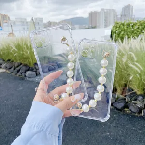 Clear silicone phone case with elegant faux pearl wrist chain strap for iPhone models.