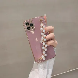 Detail view of electroplated phone case with pearl chain strap, elegant design for smartphones.