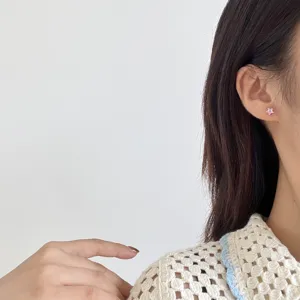 Pink star stud earrings, sterling silver zircon minimalist cute ear jewelry for women detail shot.
