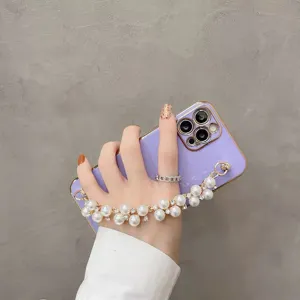Detailed view of purple electroplated phone case with elegant pearl chain strap, premium soft cover.