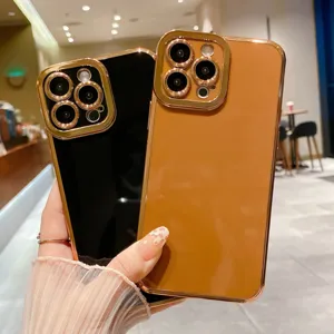 Detail view of luxury electroplated soft phone case with gold camera frame for iPhone.