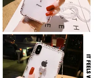 Clear rhinestone bow phone case detail showcasing transparent crystal design and sparkly bling finish.