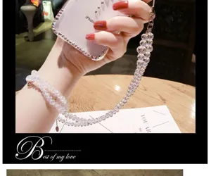 Crystal beaded phone strap and clear rhinestone phone case detail showing sparkling design.