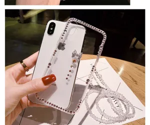 Clear rhinestone bowknot phone case with beaded lanyard for iPhone, stylish protective back cover.
