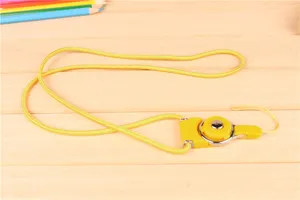 Cordon de téléphone portable à anneau rotatif amovible jaune pour bureau et usage quotidien.