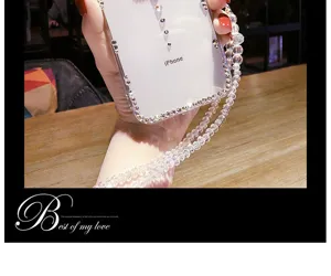 Detailed view of clear rhinestone phone case with luxury crystal beaded strap and shimmering diamonds.